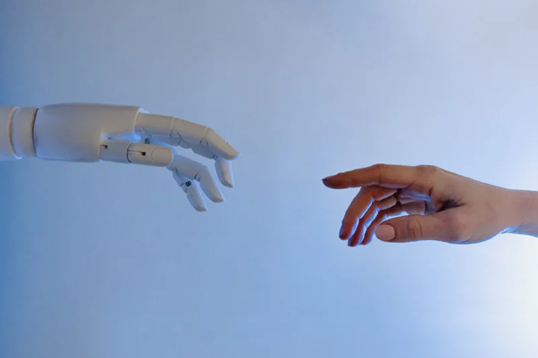 The future - a person reaching out to AI