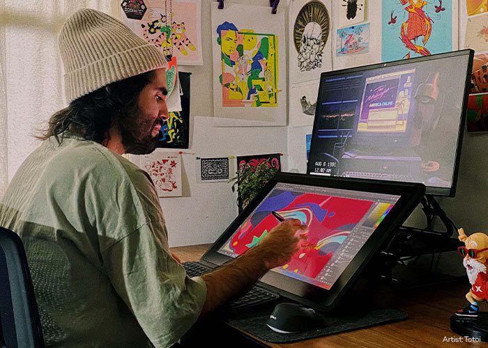 Creator using a Wacom Cintiq Pro 24 pen display