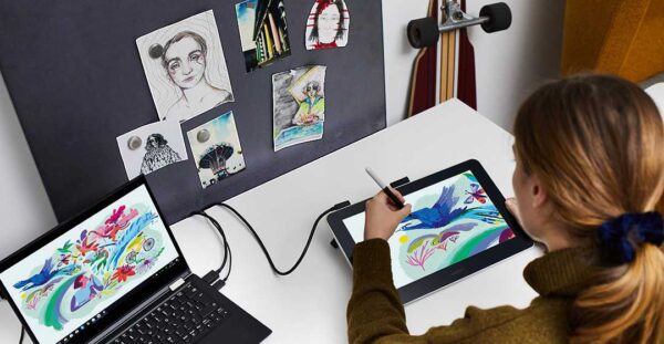 Wacom One pen display and Chromebook on a desk.